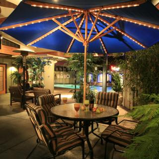 Best Western Plus Humboldt Bay Inn | Eureka, California | Outdoor patio tables, chairs, and umbrellas