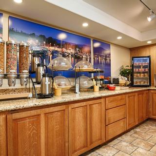 Best Western Plus Humboldt Bay Inn | Eureka, California | Breakfast area with cereal, coffee, fruit, and self serve machines