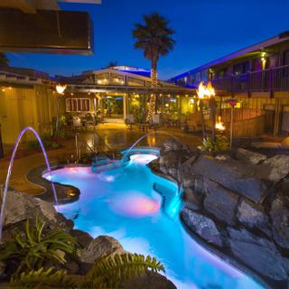 Best Western Plus Humboldt Bay Inn | Eureka, California | Outdoor lagoon pool with pink lights and patio area
